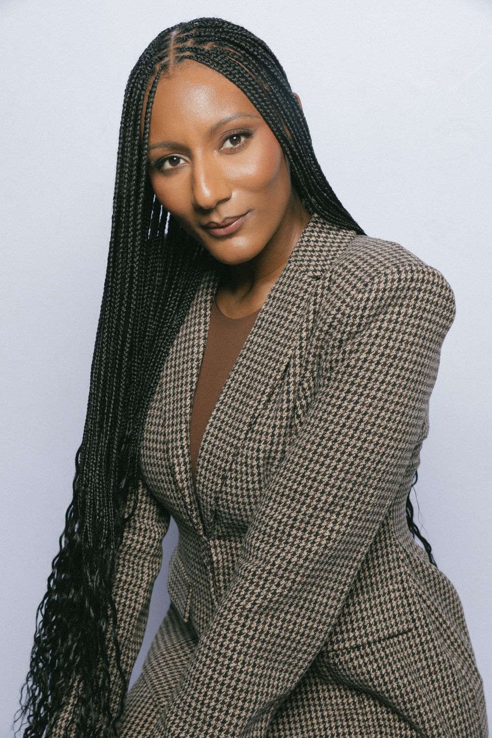 Portrait of Crysten Curry in a houndstooth blazer